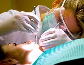 Dental Hygienist working on a patient