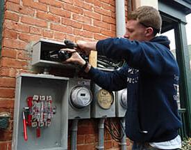 male student working on electrical meter