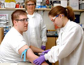 Phlebotomy Technician taking blood